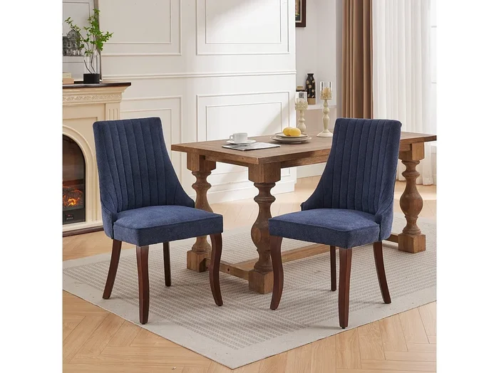 Conjunto de 2 sillas azules con patas de madera curvadas y respaldo alto.