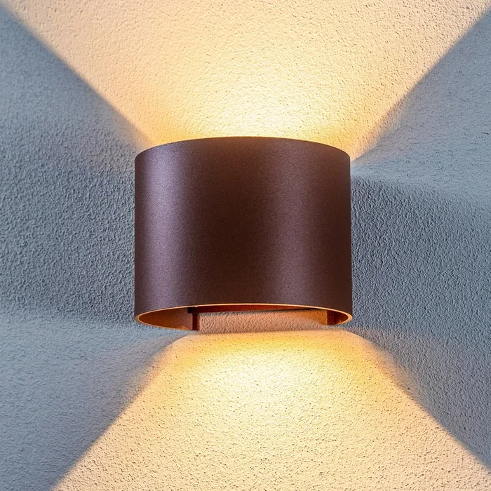 Lámpara de pared LED para exteriores Nivar de Lindby, redonda, óxido, metal,
