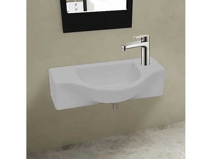 Lavabo con orificio para grifo de cerámica blanca para baño.